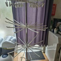 Rotating folding clothes drying rack