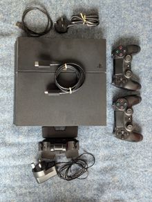 Sony PlayStation 4 Console with 2 Controllers and Charging Dock