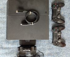Sony PlayStation 4 Console with 2 Controllers and Charging Dock
