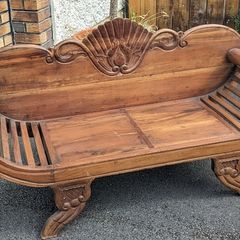 Solid wood 2-seater with scrolled arms and carving