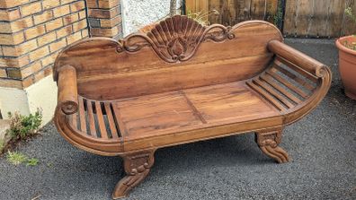 Solid wood 2-seater with scrolled arms and carving