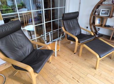 Ikea Poang brown leather chairs and matching footstool with occasional table