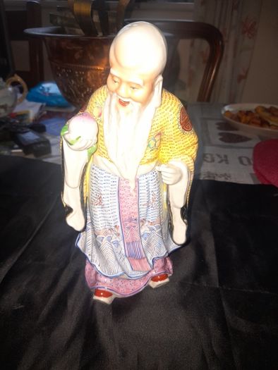 Beautiful Large Chinese Shou Xing porcelain figurine depicting the God of Longevity. It features an elderly man with a prominent bald head, holding a peach, which symbolizes long life, Postage Available, no chips or cracks