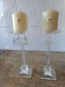 2 glass candle holders and candles