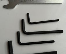 Bundle of hex keys and a wrench.