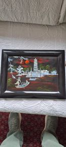 Vintage Vietnamese black lacquer wall plaque featuring intricate mother-of-pearl inlay.