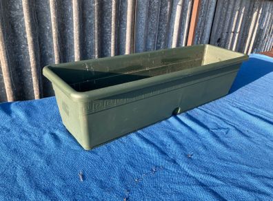 Single green plastic window box