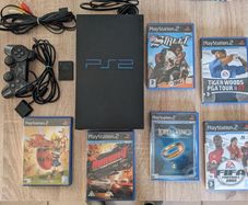 PS2 console with games
