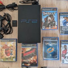 PS2 console with games