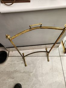 Vintage leaded glass with curved brass screen .
