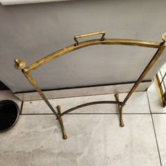 Vintage leaded glass with curved brass screen .