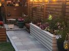 Custom timber garden fencing with integrated planters and bench Image 7