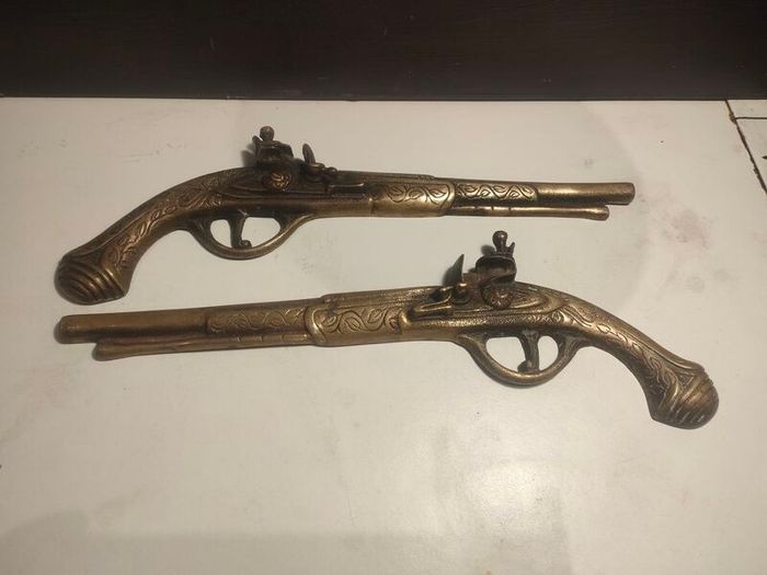 A pair of Early 20th Century 13" Brass Flintlock pistols