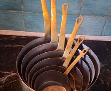 Graduated set French tinned Brass Pots and pans