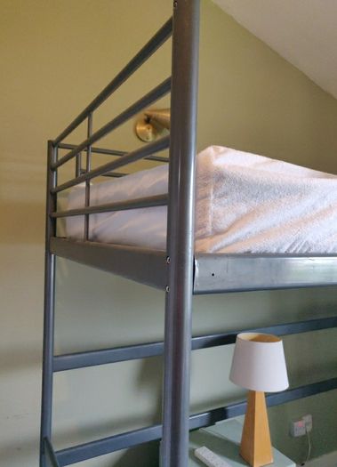 Over desk single bed.