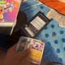 pokemon cards and book and sleeves and game thing Image 8