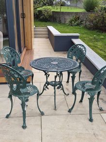 Cast metal garden table and four chairs