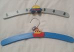 Two wooden hangers painted