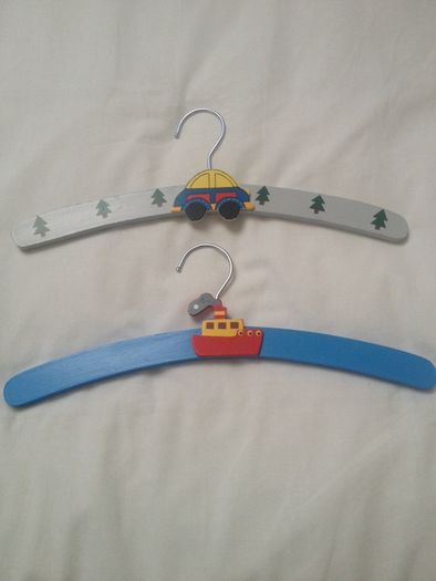 Two wooden hangers painted