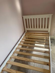White wooden single bed