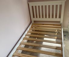 White wooden single bed
