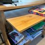 Wooden TV stand with wheels and storage shelves Image 2