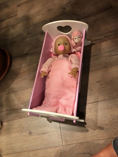 Doll crib with a baby
