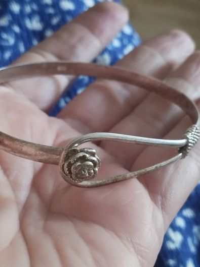 Vintage sterling silver bracelet with a rose-shaped clasp.