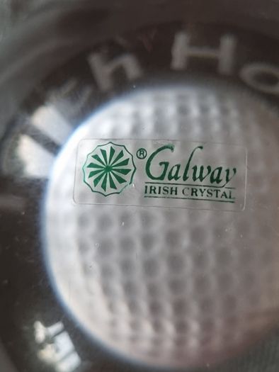 Galway Crystal paperweight with a golf ball