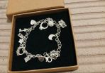 Heavy silver plated charm bracelet 11 charms on it