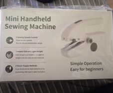 Handheld sewing machine