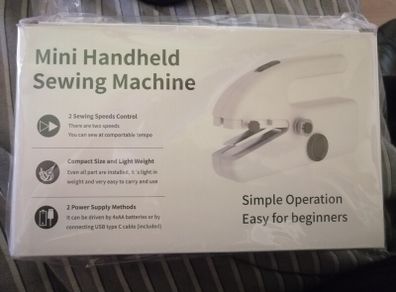 Handheld sewing machine