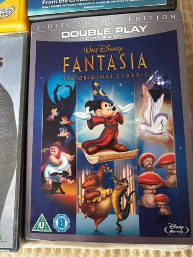 Four DVD's Fantasia (new) Goofy / March if the Penguins  & Nemo.