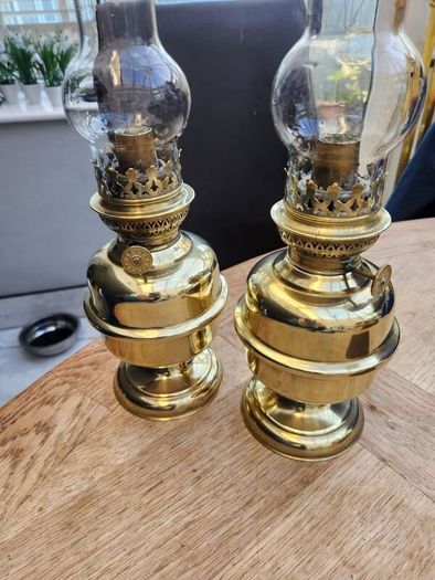 Matching pair of brass oil lamps.