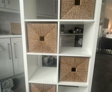 White Ikea Kallax with 4 Wicker Boxes