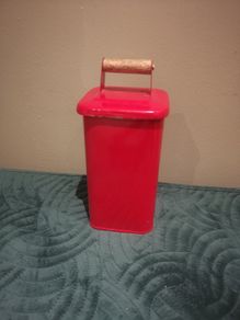 Helen James considered  red tin with lid