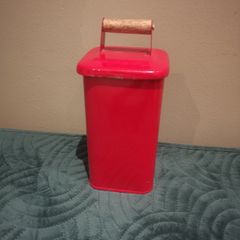 Helen James considered  red tin with lid