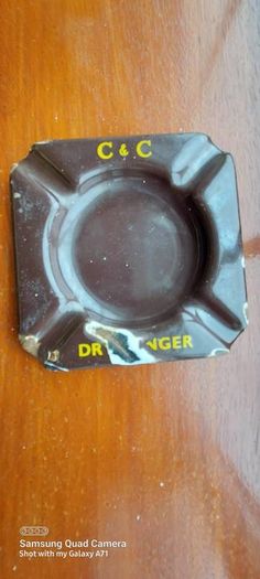 C & C Dry Ginger "ale" enamel metal ashtray ,dark brown,  very old vintage advertising ashtray, hard to come by ,collectors item,used condition  see pictures