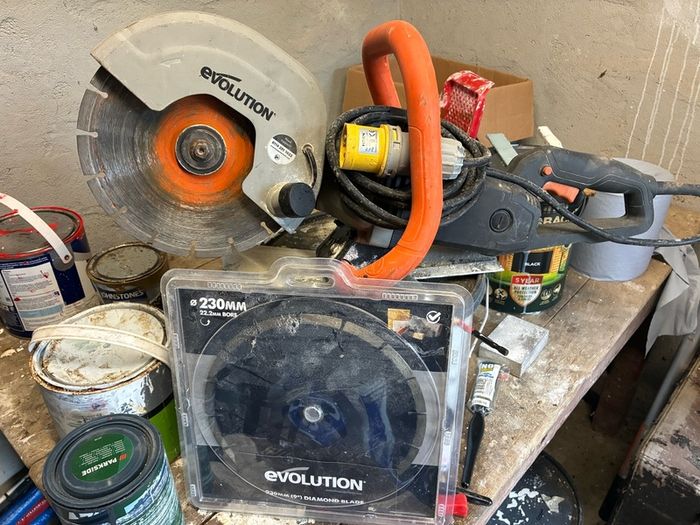 Evolution concrete saw and spare blade.