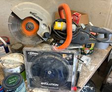 Evolution concrete saw and spare blade.