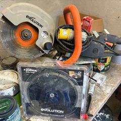 Evolution concrete saw and spare blade.