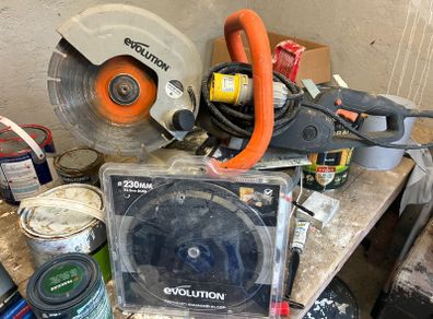 Evolution concrete saw and spare blade.