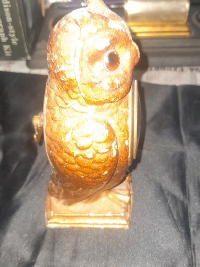 Cold Painted Bronze Clock In Form Of An Owl. The Decorative Dial Sits In The Owls Belly And Has Wind Up Movement,