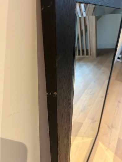 Black framed bevelled mirror