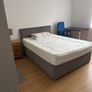 Room with double bed and attached washroom Image 2