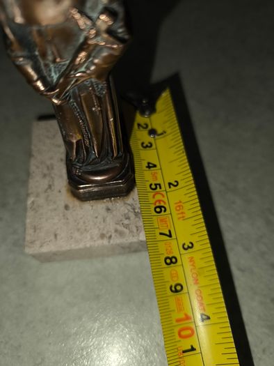 Copper Sacred art statue of Saint Francis of Assisi on marble plinth.