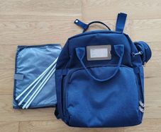 Baby changing bag with fold out bed