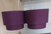 Two purple ceiling light shades