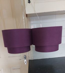 Two purple ceiling light shades