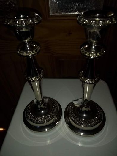 Set of tow silver plated candle holder.  23.5 cm. tall